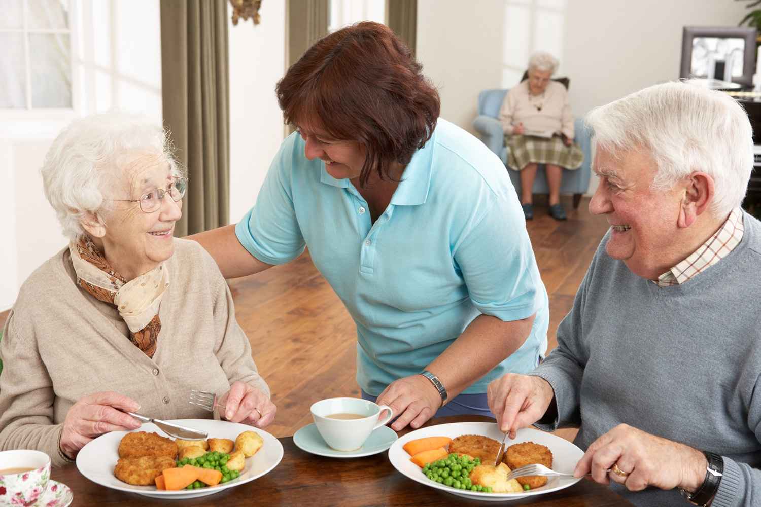 Care Staff Helping Senior Residents During Lunch at a Skilled Nursing Community in Weatherford, TX