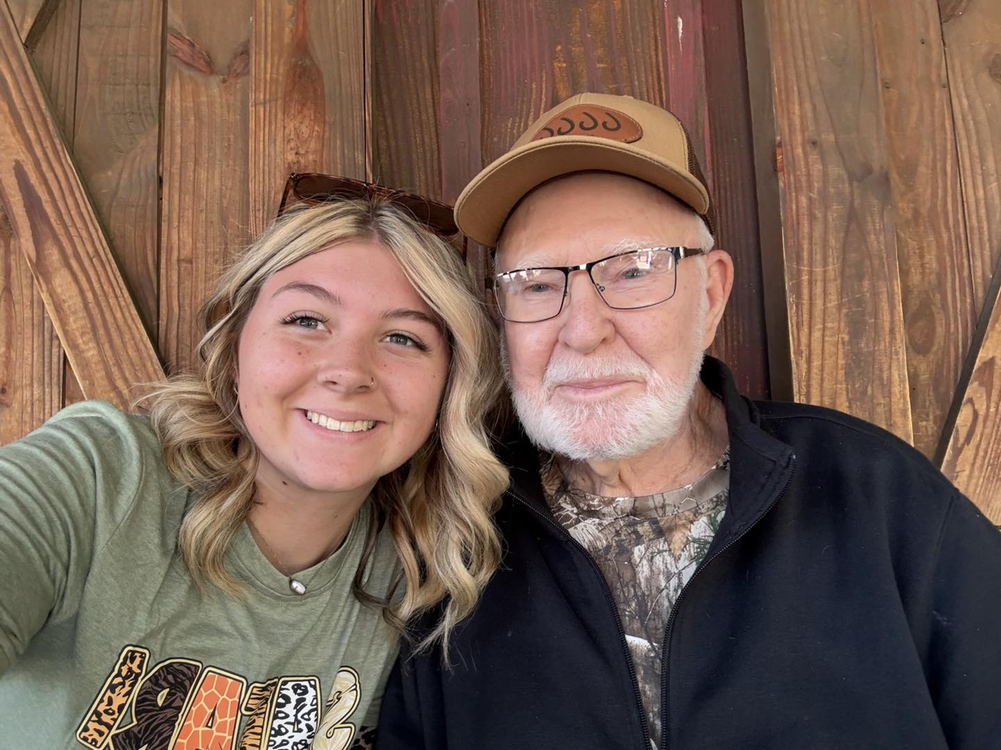 Elderly man with nursing home staff going on a trip to the zoo in Weatherford, TX